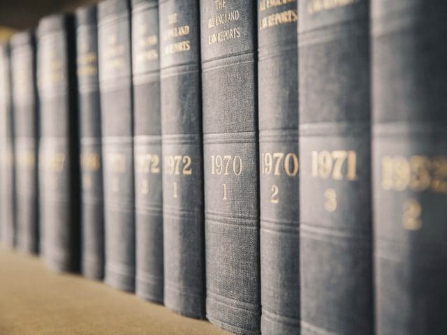 Law books sit on a bookshelf